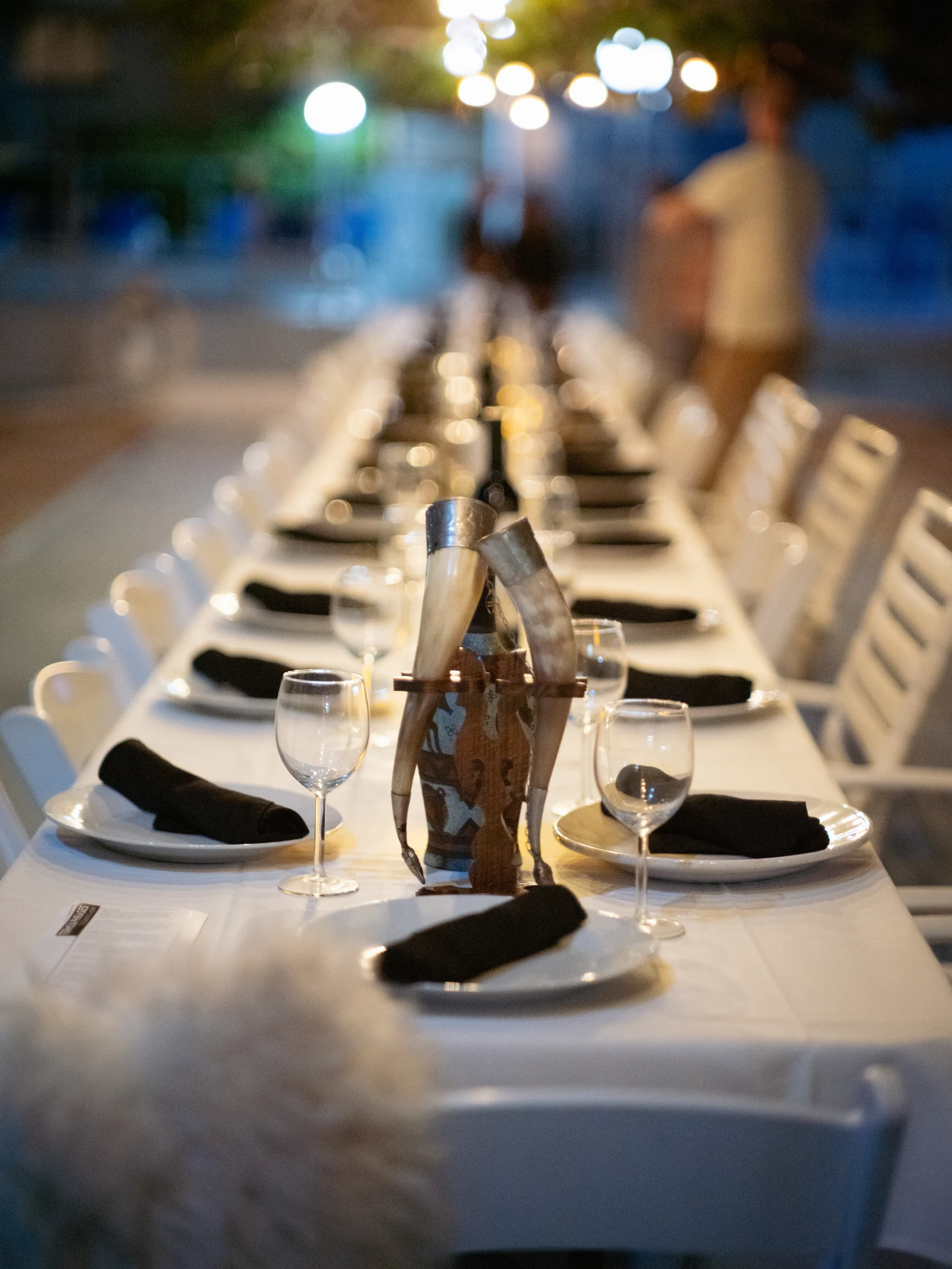 A long table is prepared before guests arrive.