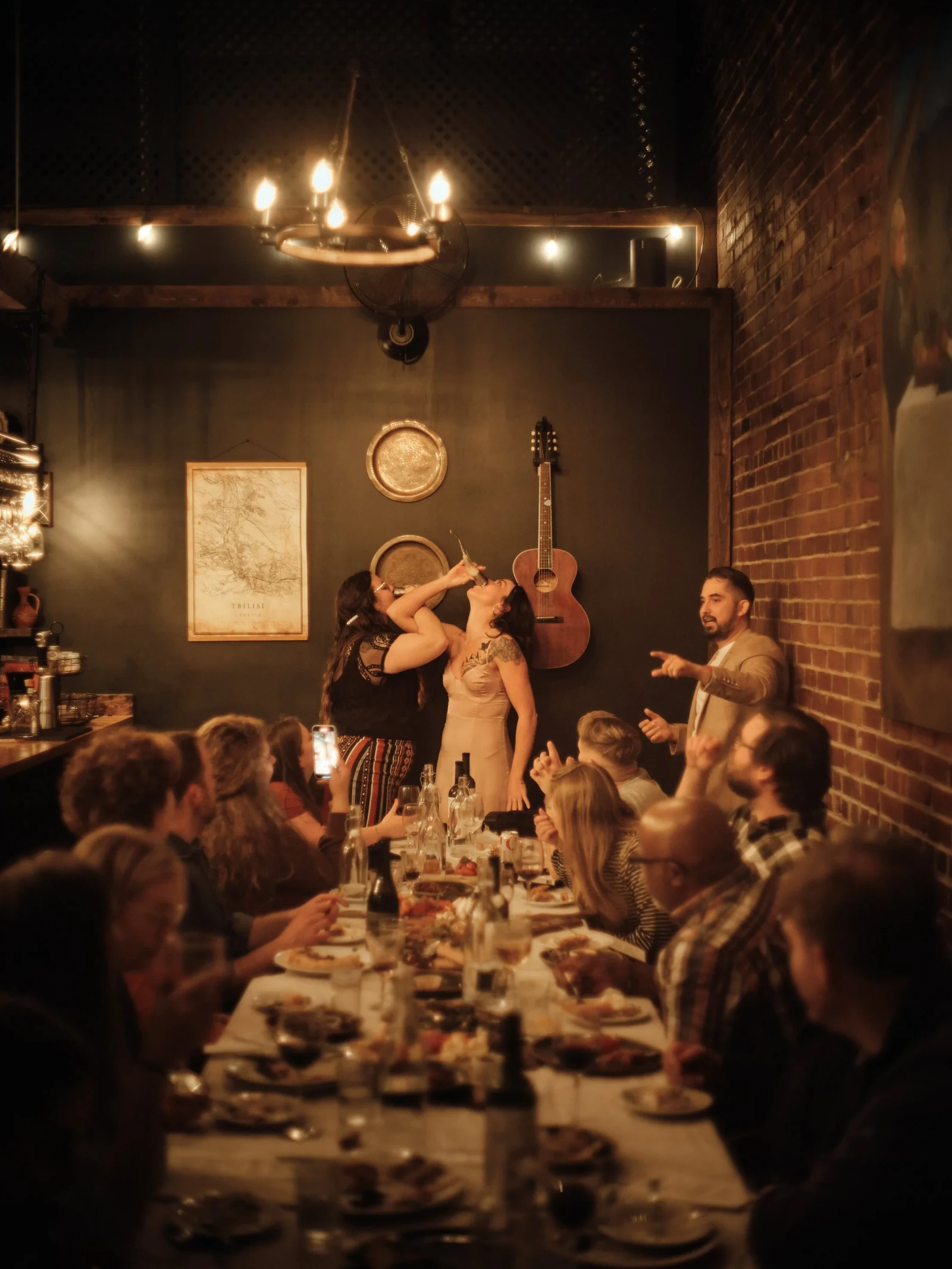 Guests participate in a toast around the table.