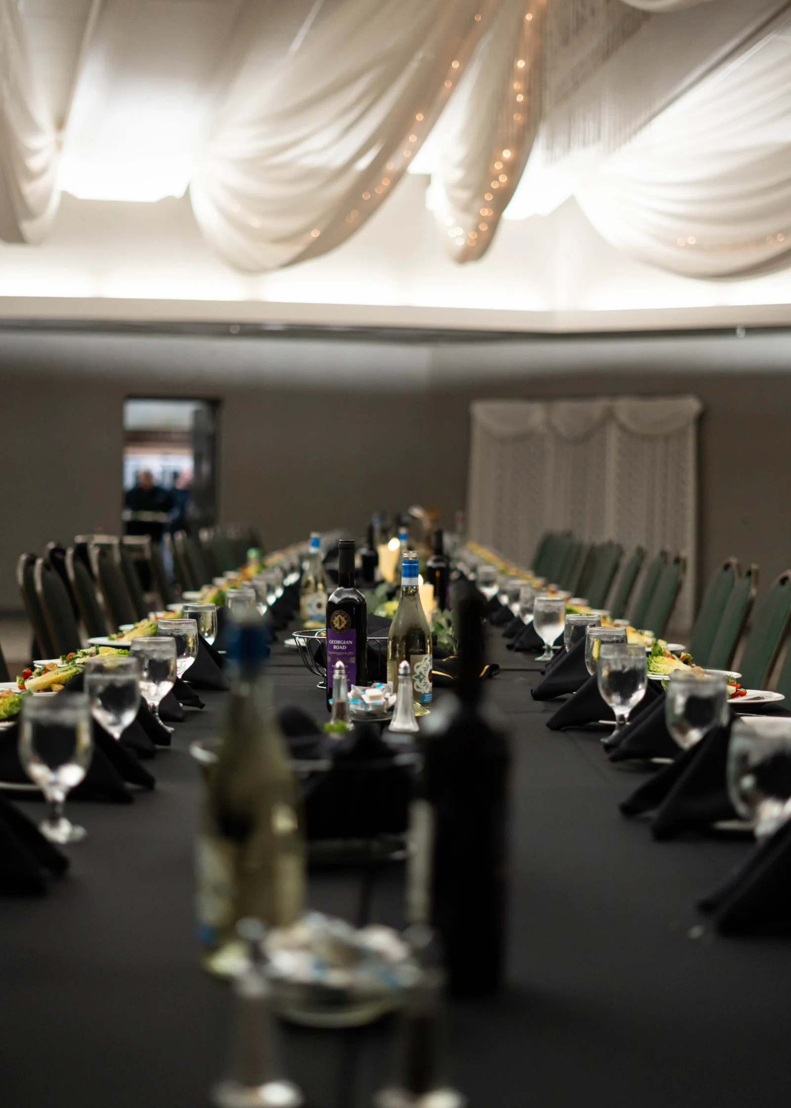 A long Supra table is set before guests arrive.
