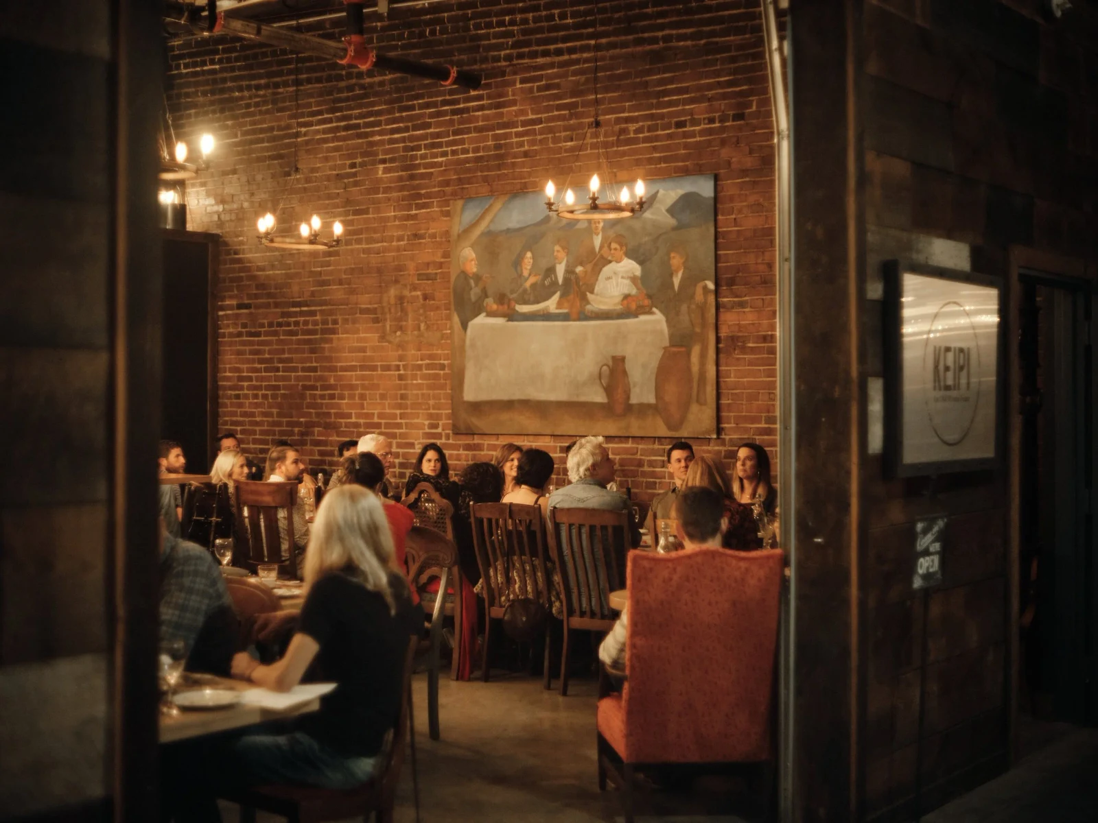 People gather around a table at Keipi Restaurant.